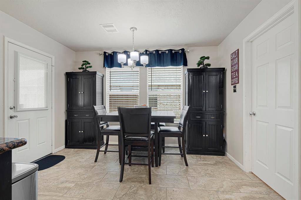 Dining area featuring a spacious and, perfect for gatherings, with warm natural light.