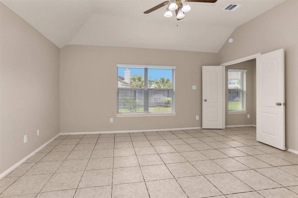 Expansive primary suite comfortably fits king-sized furniture with room to spare