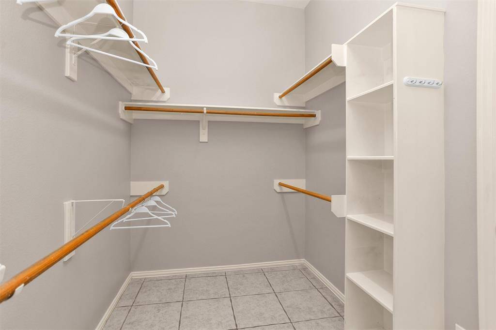 Oversized closet situated within the elegant primary bath retreat