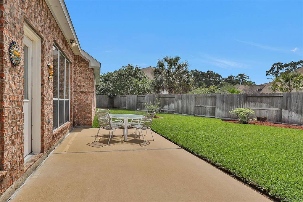 Vast backyard oasis with a spacious patio ideal for relaxation and gatherings