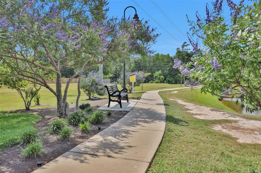 Nearby, the neighborhood walking trail offers a well-kept, scenic path for outdoor activities