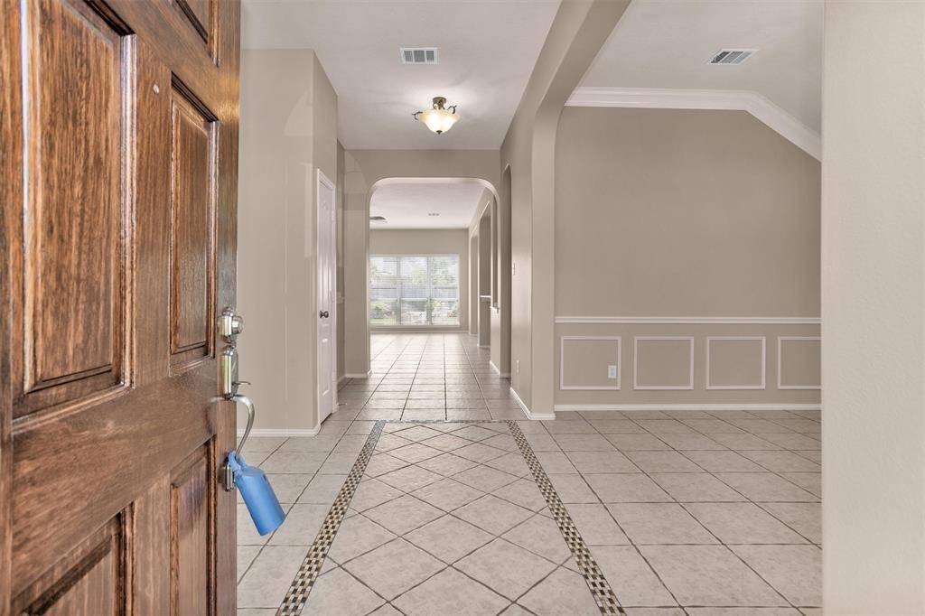 Open the door and discover the WOW factor!  Neutral tile throughout the home