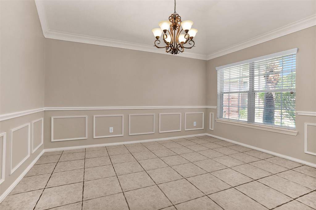 This room could easily accommodate a large dining set.  Or perhaps use as a den or playroom, so many options!