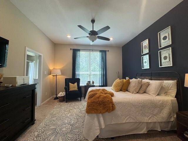 View of the primary bedroom- tons of natural light