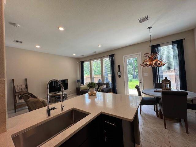 Looking across the breakfast bar into the living spaces.