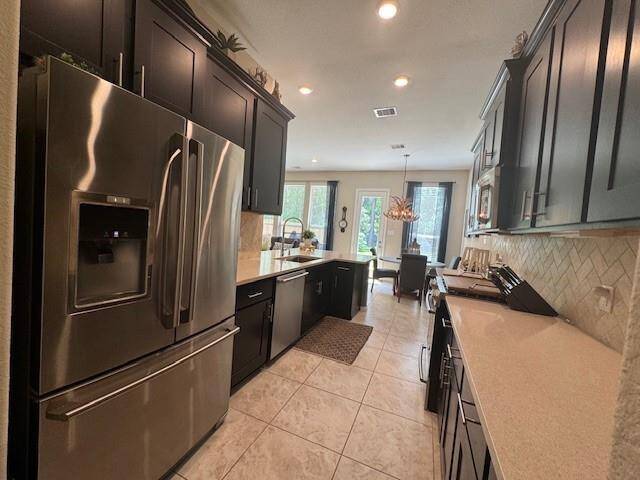 Stainless refrigerator included.