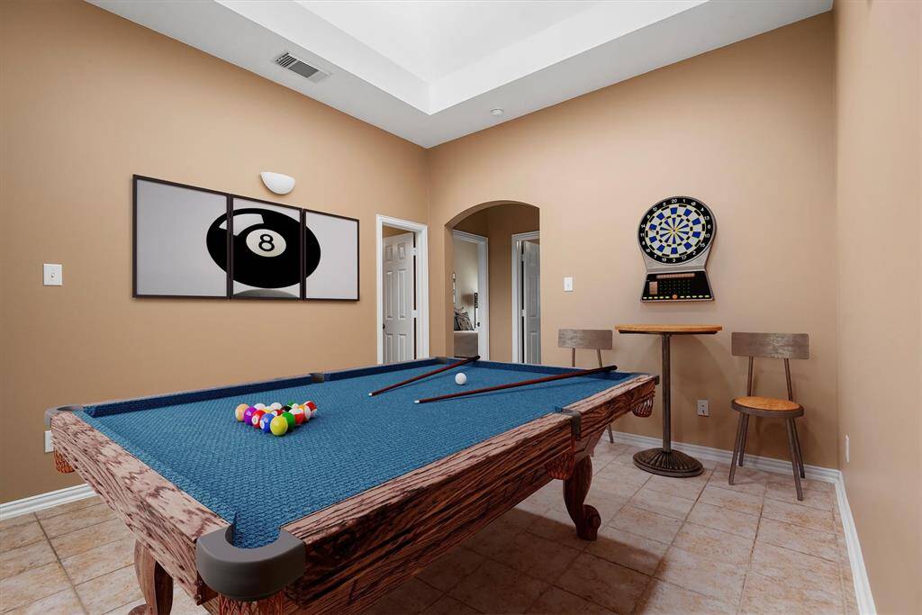 Game room virtually staged.