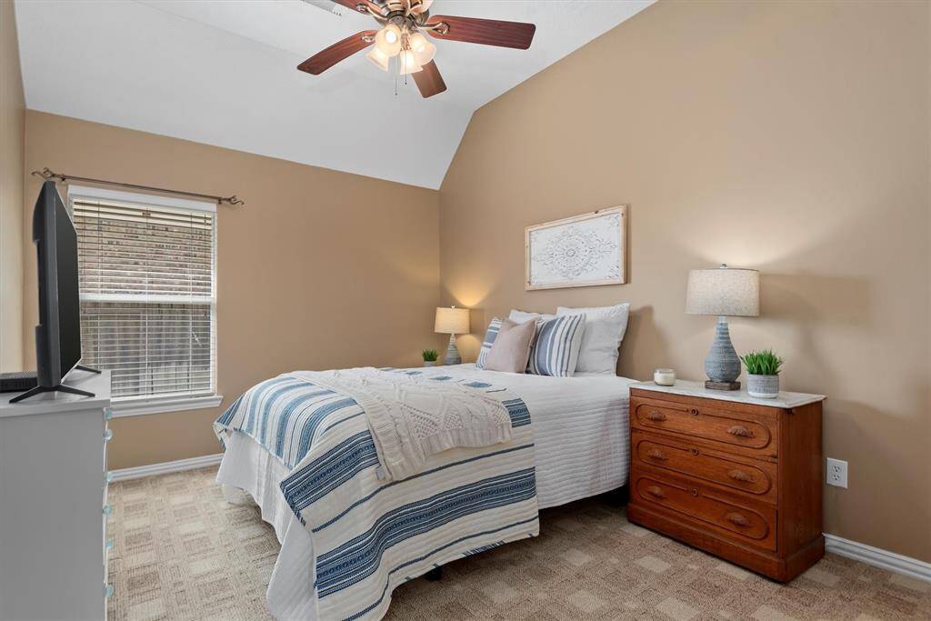Secondary bedroom 2 of 3.  The vaulted ceiling makes the room even larger.