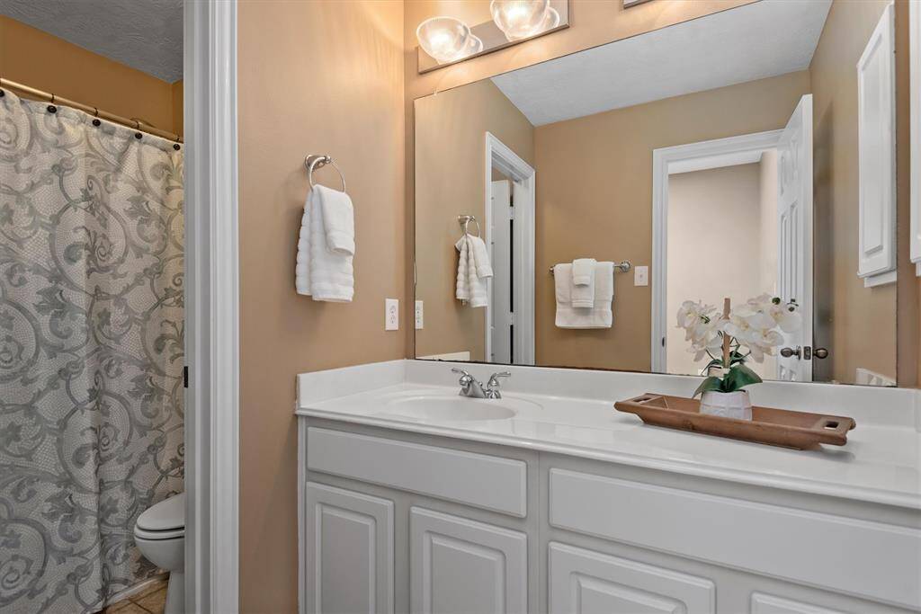 Secondary bathroom 2 is easily accessible from the bedrooms and the game room.  This bathroom has a door between the vanity and the tub toilet area making it easy for more than one person to utilize at the same time.  This could be a morning routine lifesaver.
