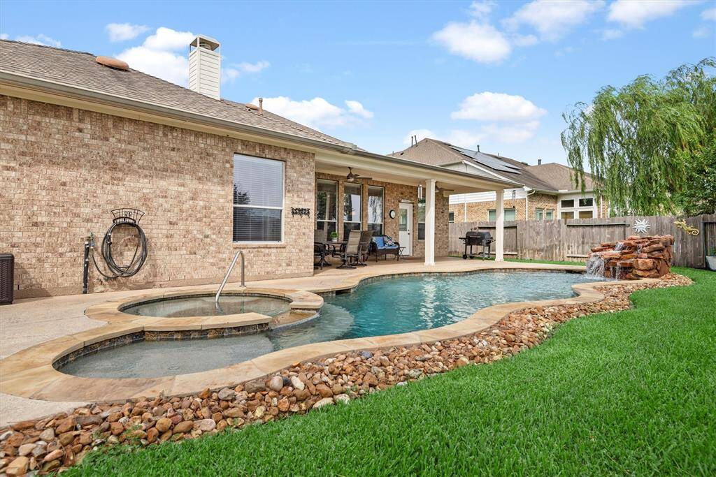 There's green space too.  Check out the tomatoes, pepper plants and cucumbers along the back fence.  Even with a pool you have enough room to truly enjoy your backyard.
