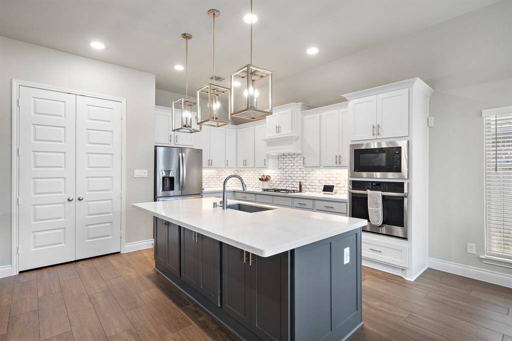 The heart of the home features a generous island with plenty of space for bar seating.