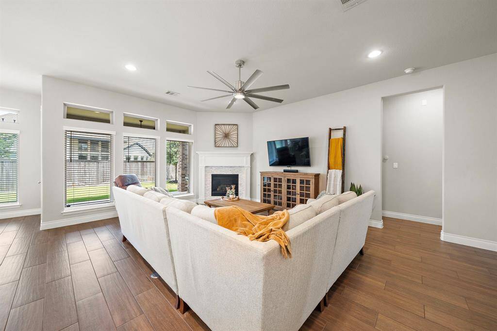 Natural light dances through the space, creating warmth and openness.
