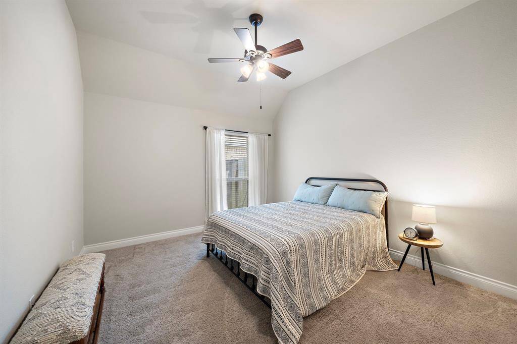 Two additional bedrooms share a full bath—offering flexibility for family, guests, or creative spaces.