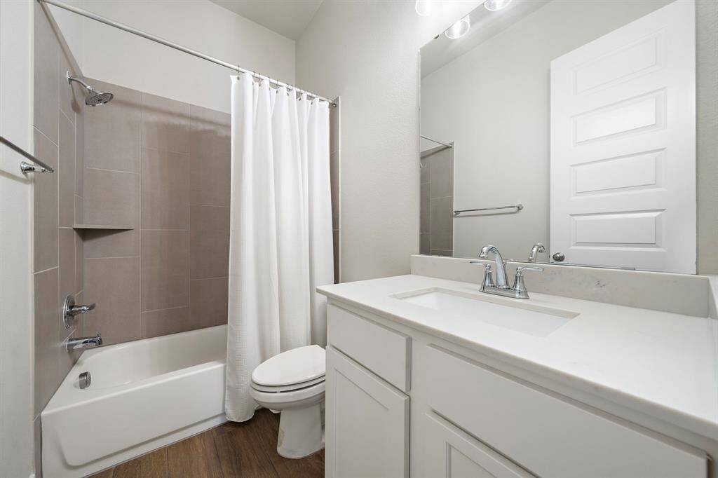 Full size bathroom for the two other bedrooms to share offering tub/shower combo and a single vanity.