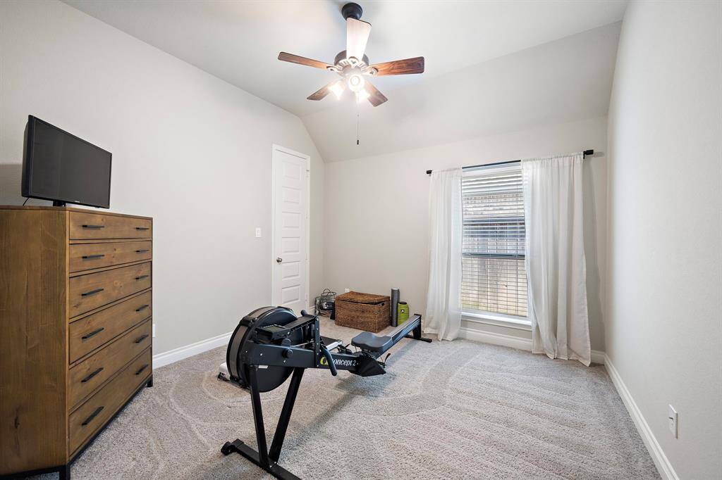 Two additional bedrooms share a full bath—offering flexibility for family, guests, or creative spaces.