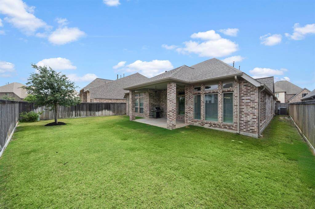 Fully fenced backyard provides privacy and plenty of space for kids, pets, or a future garden.