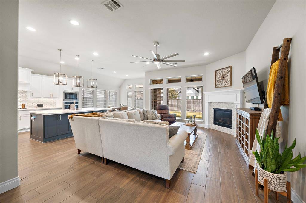 The living area flows seamlessly into the kitchen and dining area.