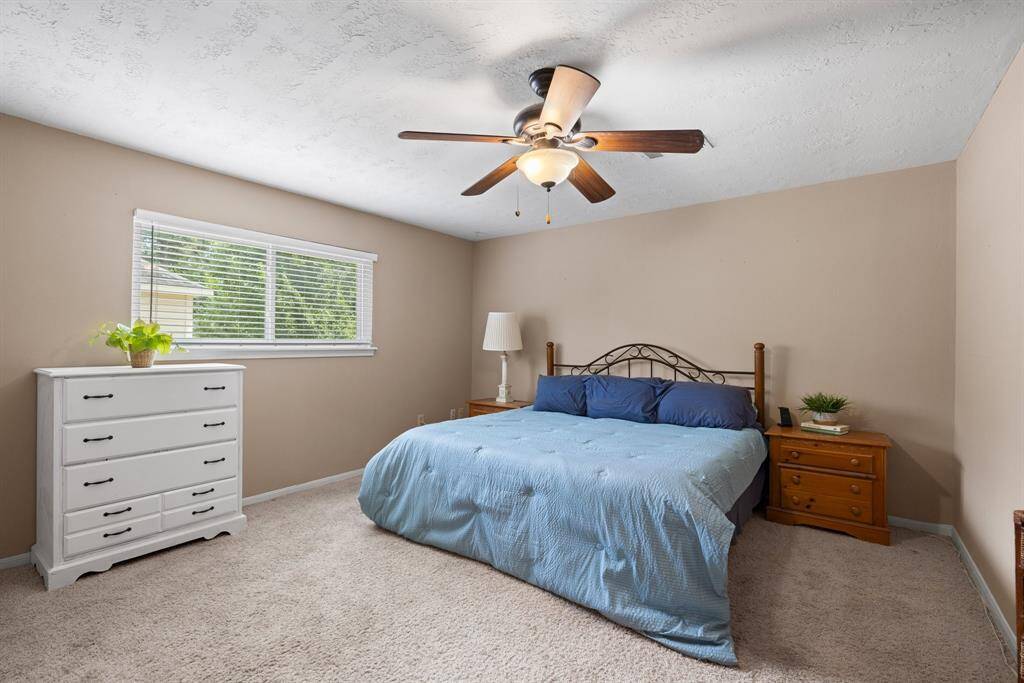 PRIMARY BEDROOM - Large bedroom has space for your king-sized furniture.