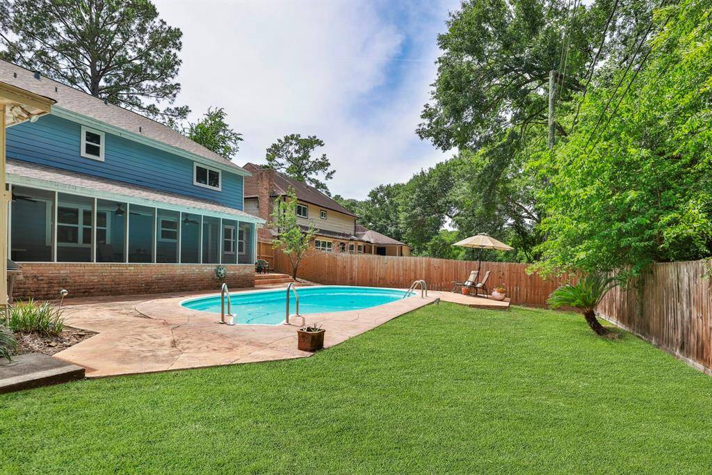 BACK YARD - This view shows how much green space is available for kids and pets to play.  It also shows the size of the screened porch.  Siding on house was replaced in 2019 with LP Smartside.