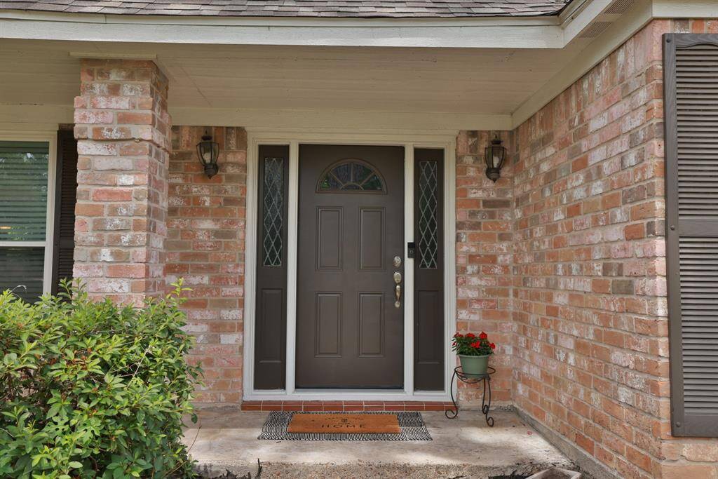 Welcoming front porch!  Front door replaced April 2025.