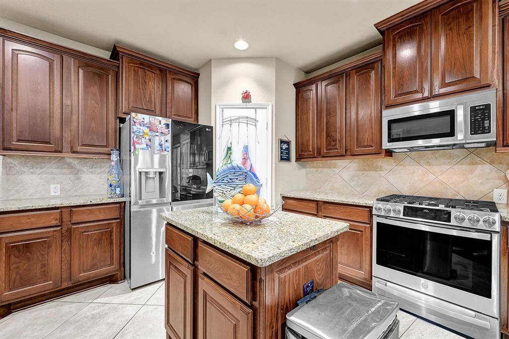 Kitchen with granite counter top & Stainless steel appliances