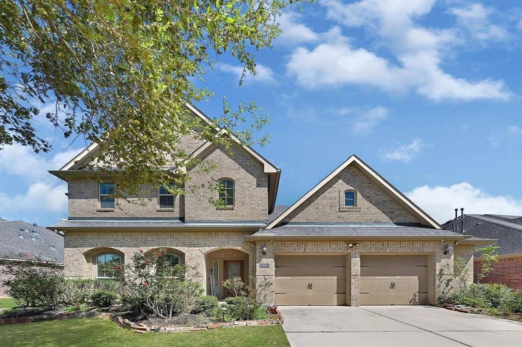 Elegant Two-Story Brick Home with Impressive Curb Appeal!