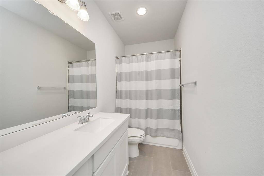 The shared secondary bathroom is located between bedroom #3 and bedroom #4. Notice the ample countertop space!