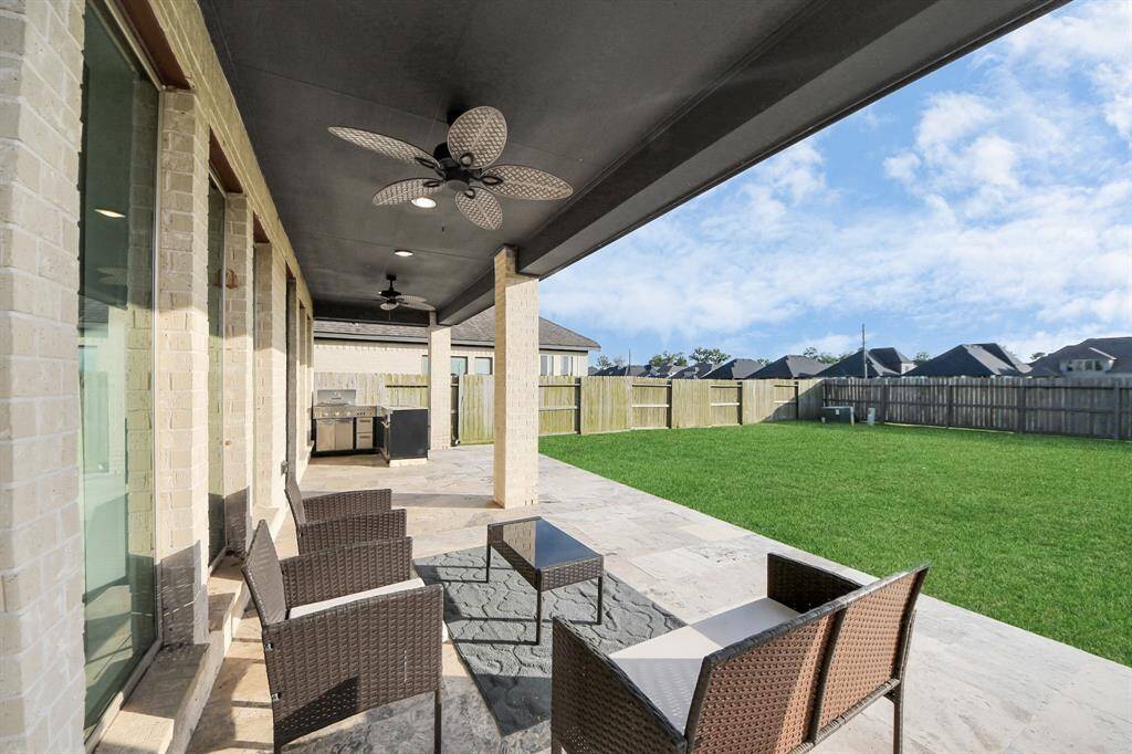 Did you notice the fans? You can enjoy this patio year-round!