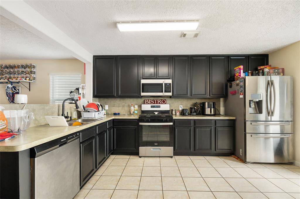 Imagine the memories you'll create in this kitchen—where everyday meals and special moments come together in a space designed for both comfort and convenience.
