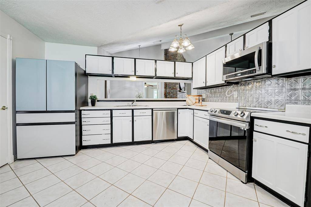 The high-end Samsung refrigerator will be staying with the house. All other stainless steel appliances are newer.