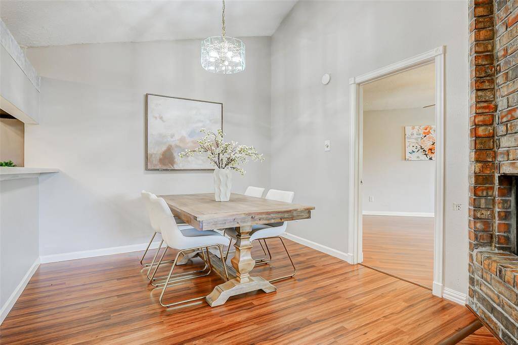 The primary bedroom is located off the dining room which is on the left side of the home.