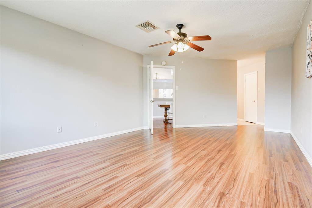 View from the windows back toward the doorway and the primary bathroom.
