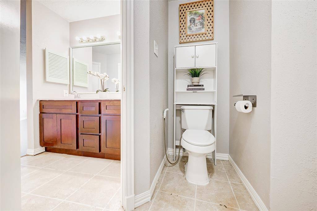 This shows the separation between the vanity and the toilet and tub/shower area.