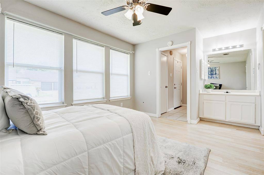 The front bedroom has a private vanity and a doorway which leads to the secondary bathroom.