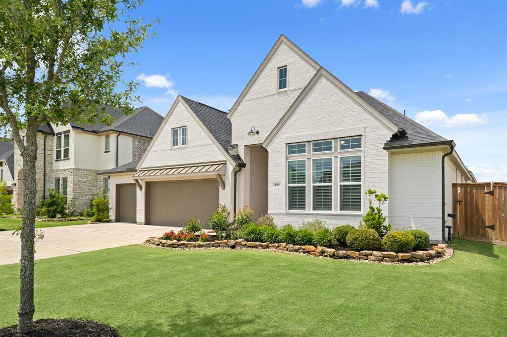 A thoughtfully designed single-wide driveway expands into a triple-wide approach, offering effortless access to the 3-car garage. Eye-catching front-facing windows and meticulous landscaping with a gravel and stone border elevate the curb appeal. The home’s exterior showcases a refined palette of Toque White for the body, complemented by Amazing Gray trim and Porpoise accents for a timeless, upscale finish.