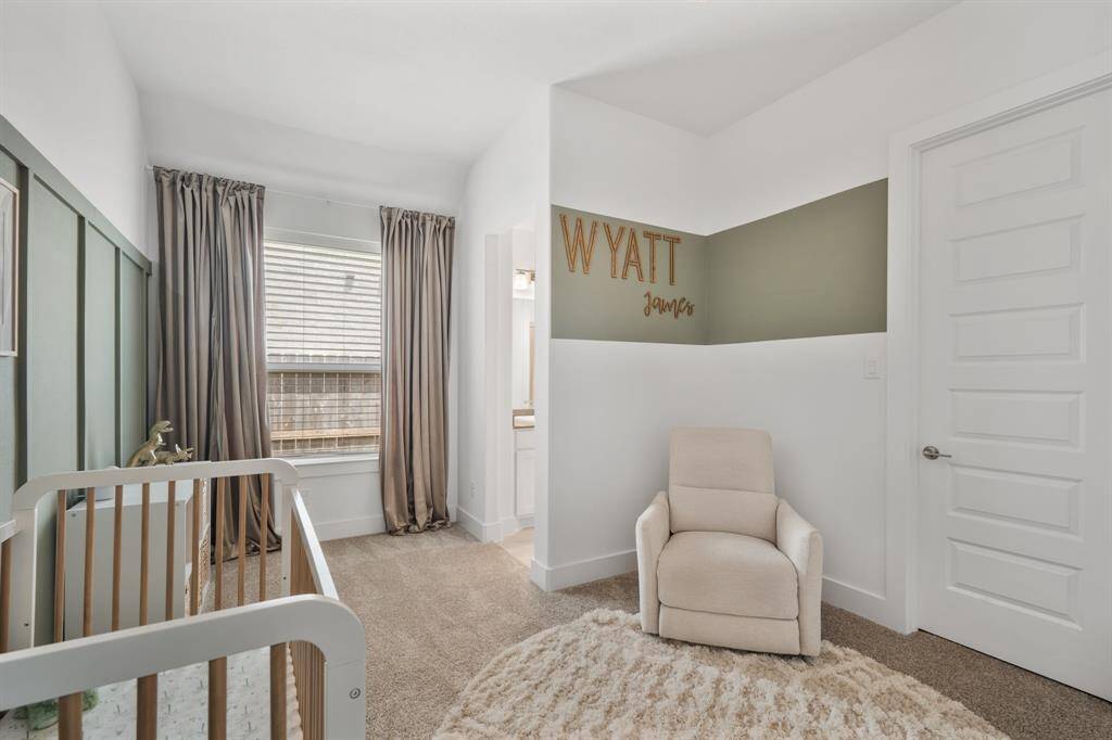 A large window floods the space with natural light and offers views of the side yard.