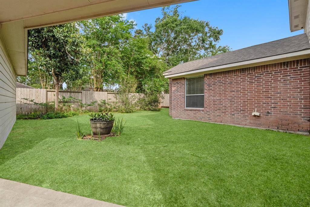 Backyard with virtually staged grass