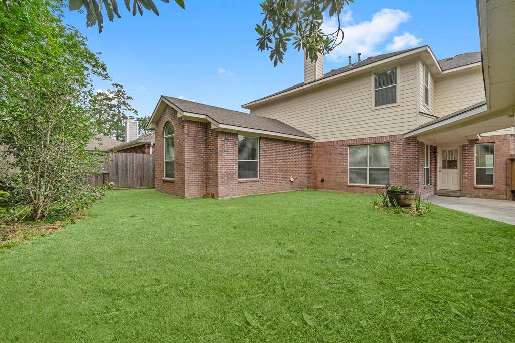 Backyard with virtually staged grass