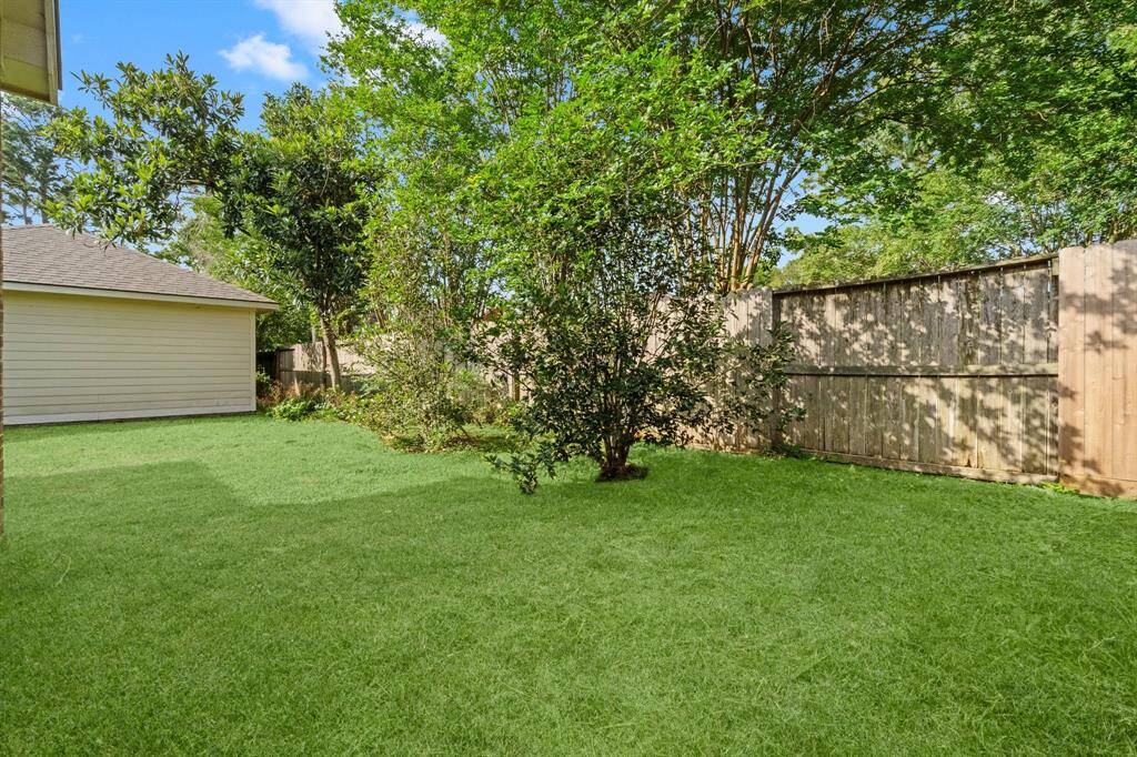 Backyard with virtually staged grass