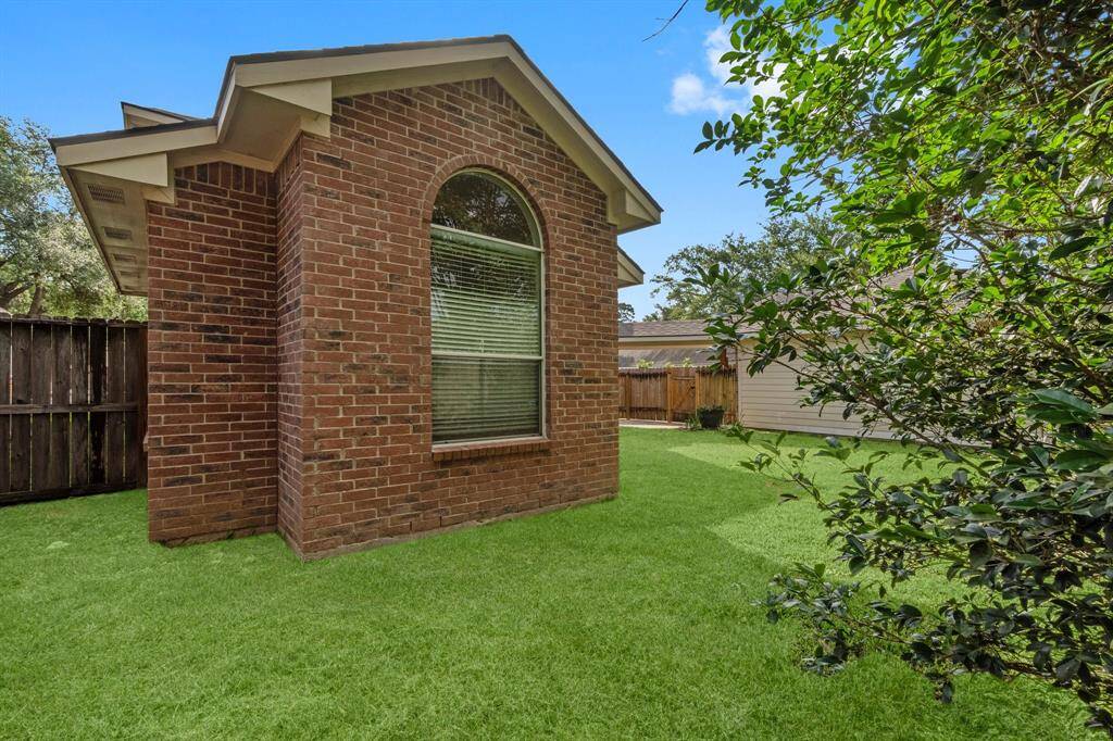 Backyard with virtually staged grass