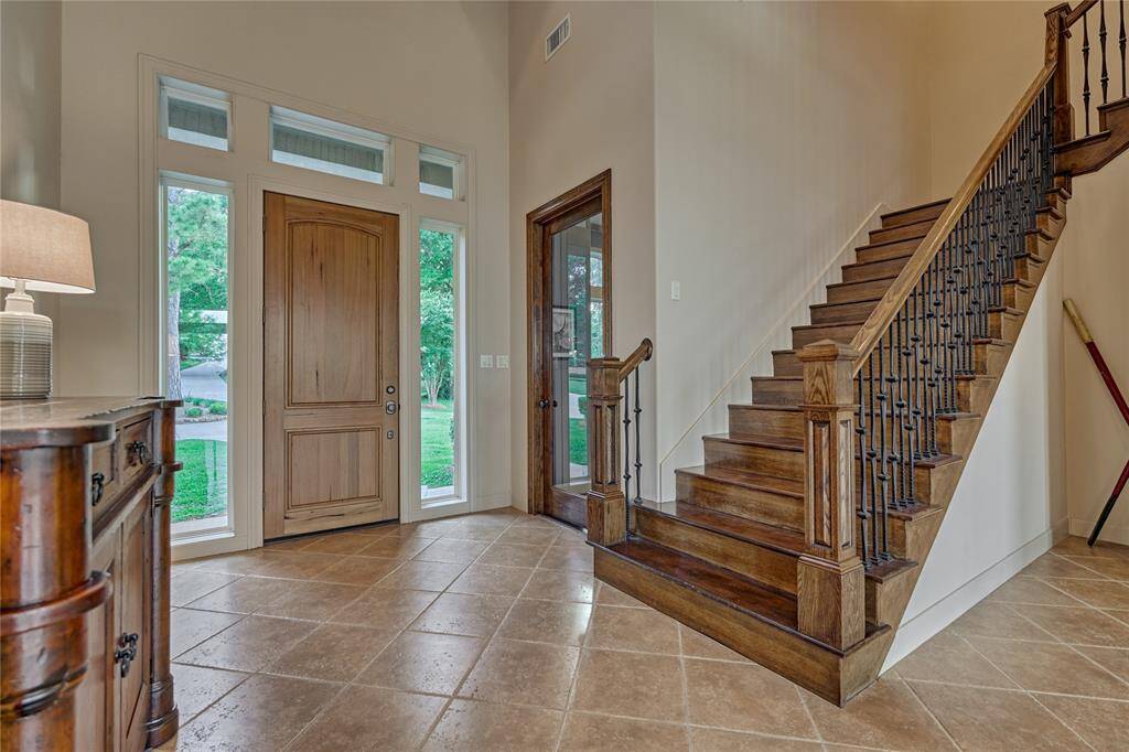 Rich wood details can be found all throughout this stunning home as shown here on the staircase.