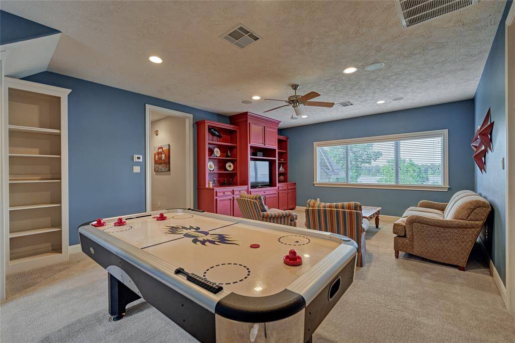 The game room offers space for entertaining and great storage.