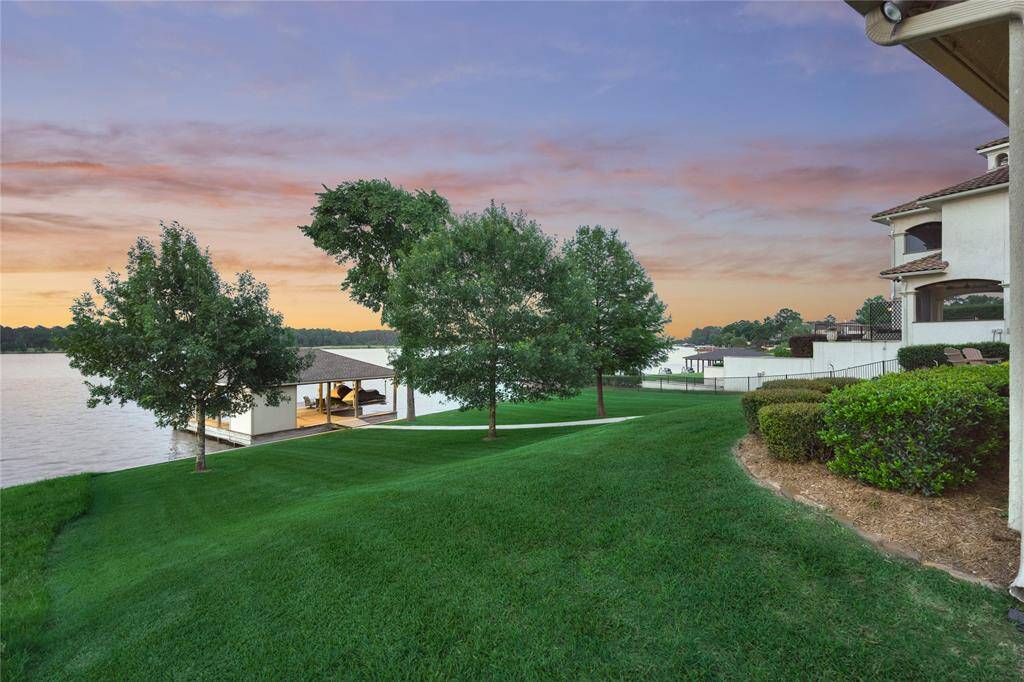 Experience serene beauty with a lush lawn and breathtaking views in your backyard paradise.