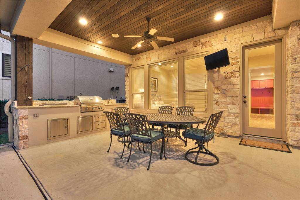 Experience the perfect outdoor oasis with a stylish summer kitchen, ideal for BBQs and entertaining guests.