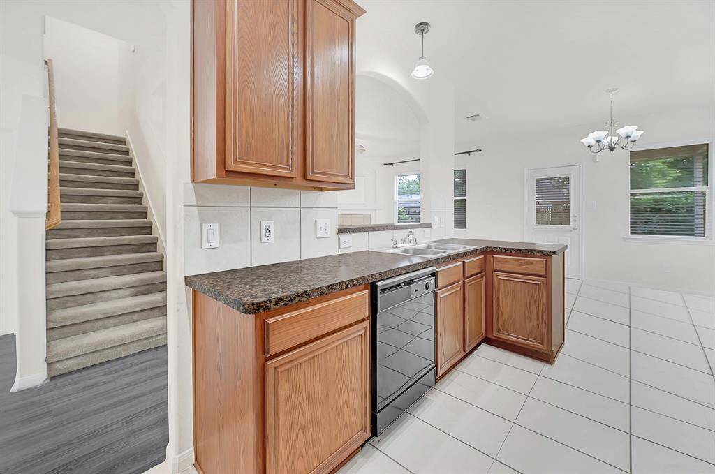 The kitchen has great views to the living room from the kitchen sink and breakfast table area.