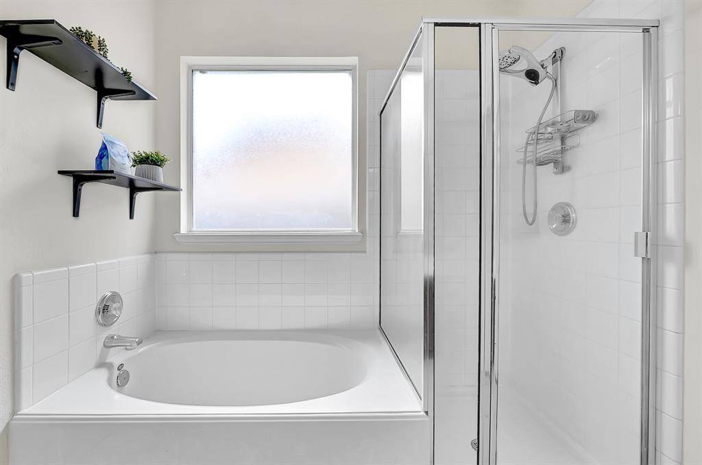 Whether you prefer a shower or a relaxing soak in the tub, this home has got you covered! The room stays bright, yet private, with the frosted window.