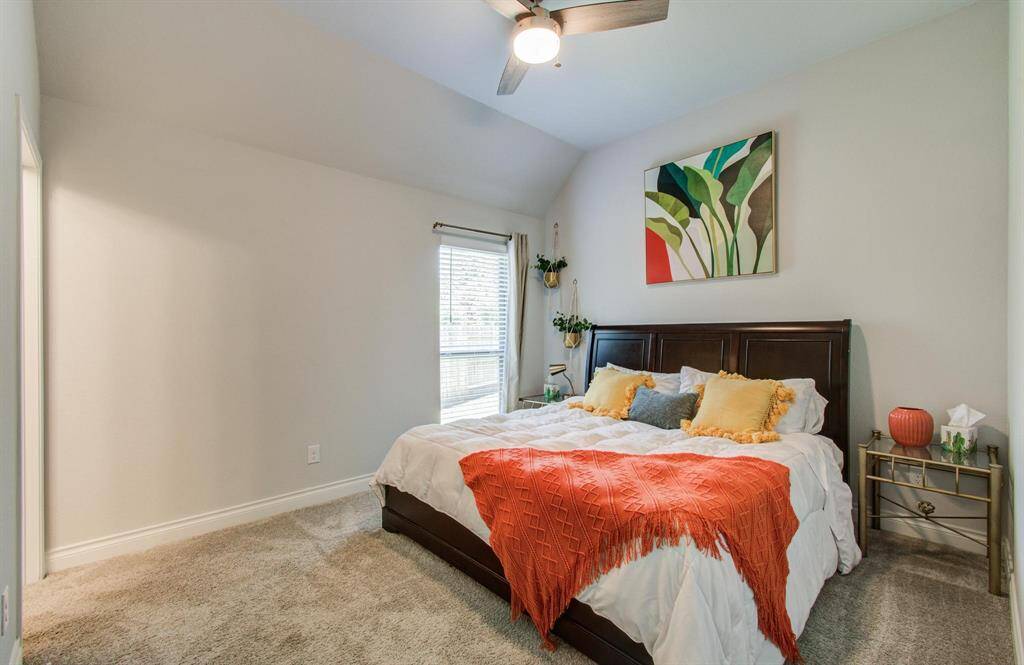 Bedroom 2 is thoughtfully positioned near the front of the home and features its own private bath—perfect for guests or extended stays. The layout of all bedrooms was designed with privacy and functionality in mind, making the most of the home’s well-planned footprint.