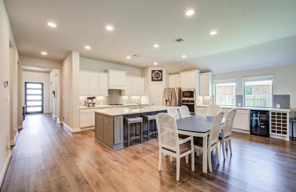This open-concept layout makes the most of every square foot. Even as a single-story home, the space feels expansive and thoughtfully designed. The kitchen flows seamlessly into the living and dining areas—perfect for everyday living and entertaining.