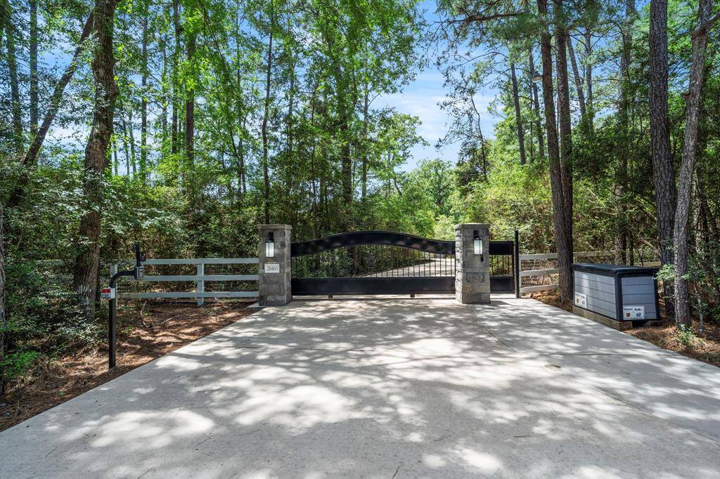 The gated entry offers both privacy and security, with access available via a coded keypad or remote control. A separate pedestrian gate features its own unique code for added protection. A custom 5x3 parcel box is also included, providing a secure, weather-protected space for deliveries.