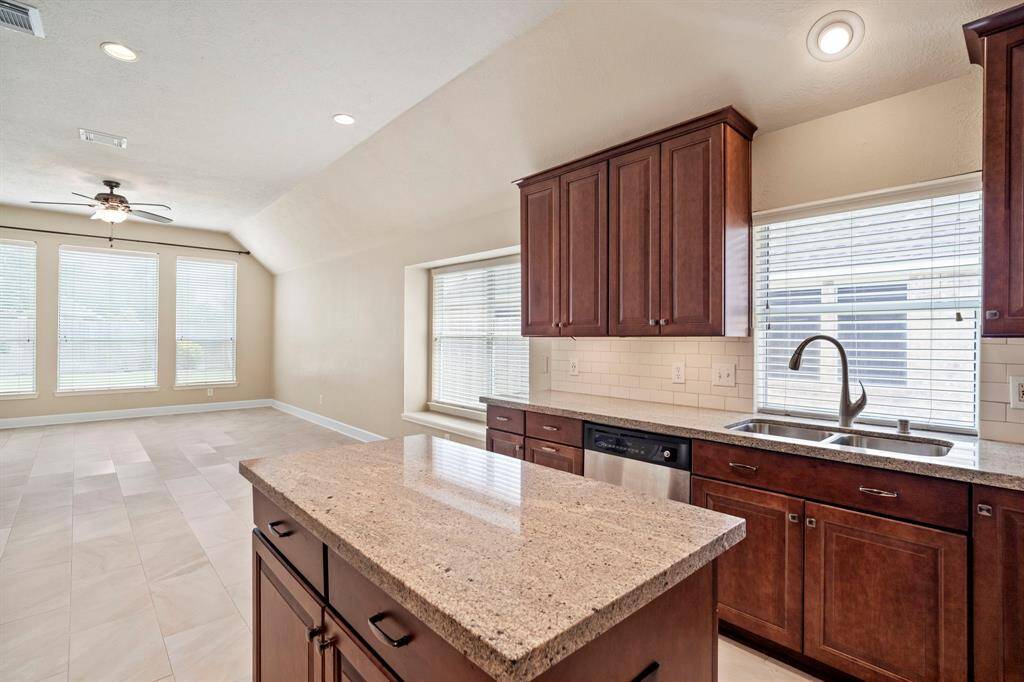 A kitchen window over the sink always makes me smile, what about you?  Notice hardware on the cabinets.